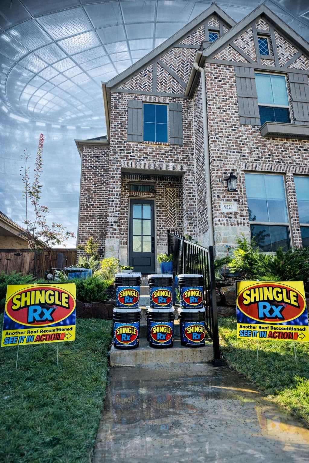 Home with Shingle RX roofing product displayed prominently in front yard. Ideal for roof restoration.